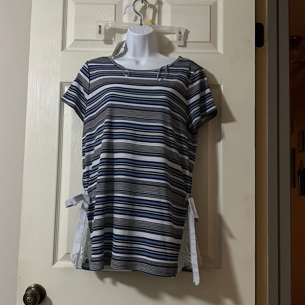 Beautiful loose fitting blouse with a variety of embellishments